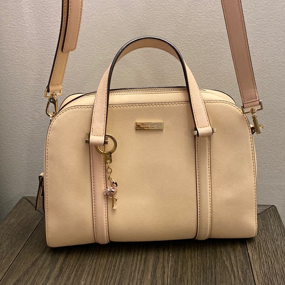 kate spade Handbags - Good condition blush cross body with flamingo key chain